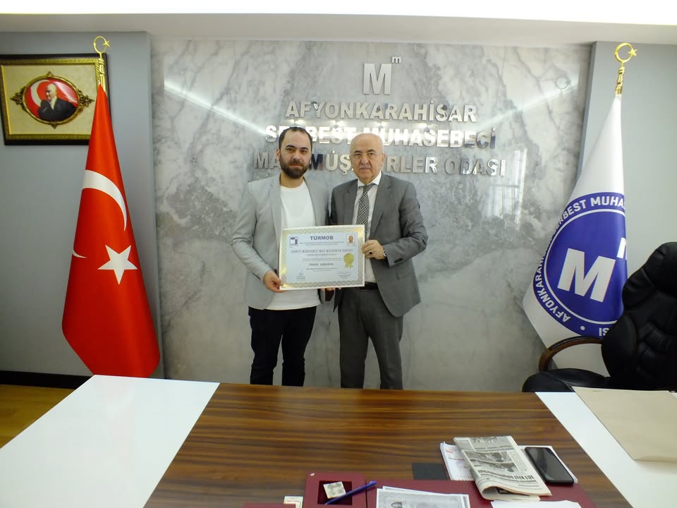 Afyonkarahisar Mali Müşavirler Odası'ndan Önder Karaman'a Ruhsat Takdimi